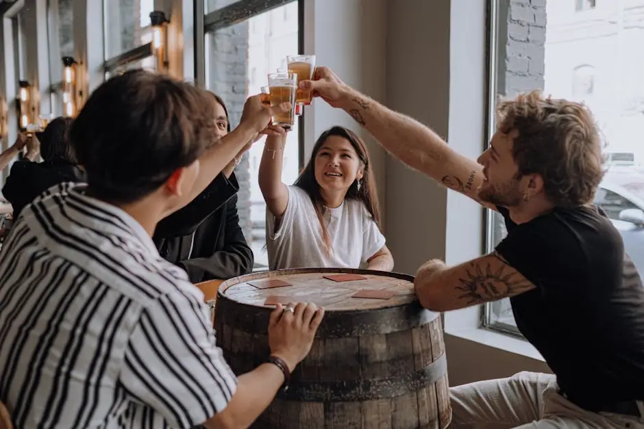 A cheerful group of friends raises their glasses for a toast in a cozy pub setting.